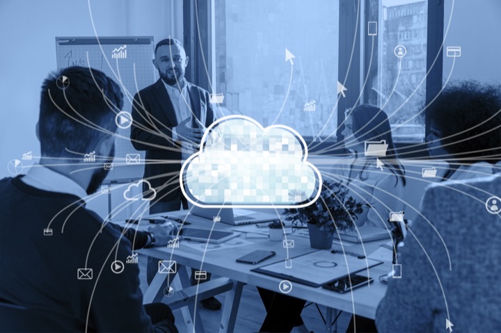 Enterprise team with a glowing cloud and connected network icons representing Azure migration and hybrid cloud architecture